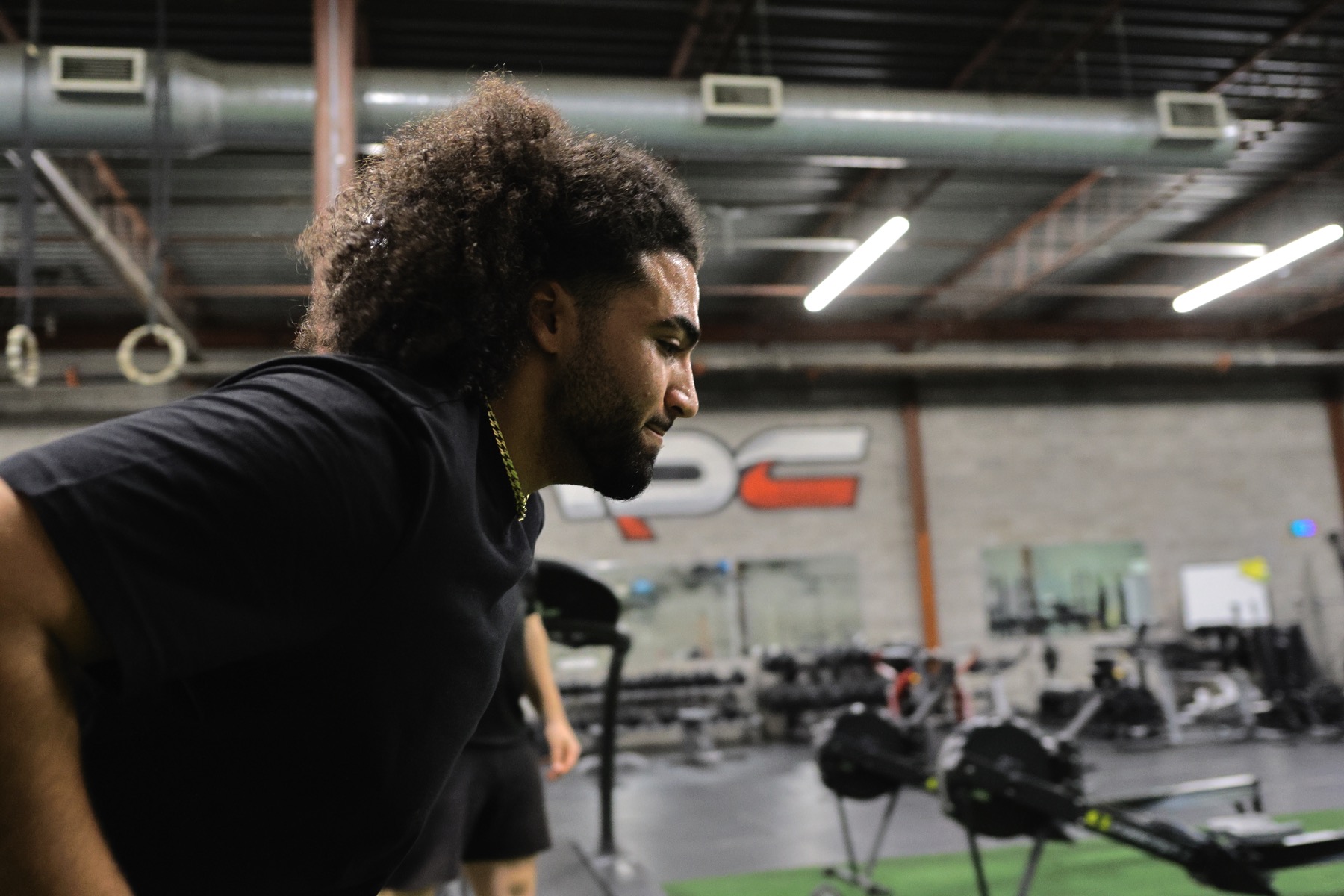 Coach leading a training session in a gym