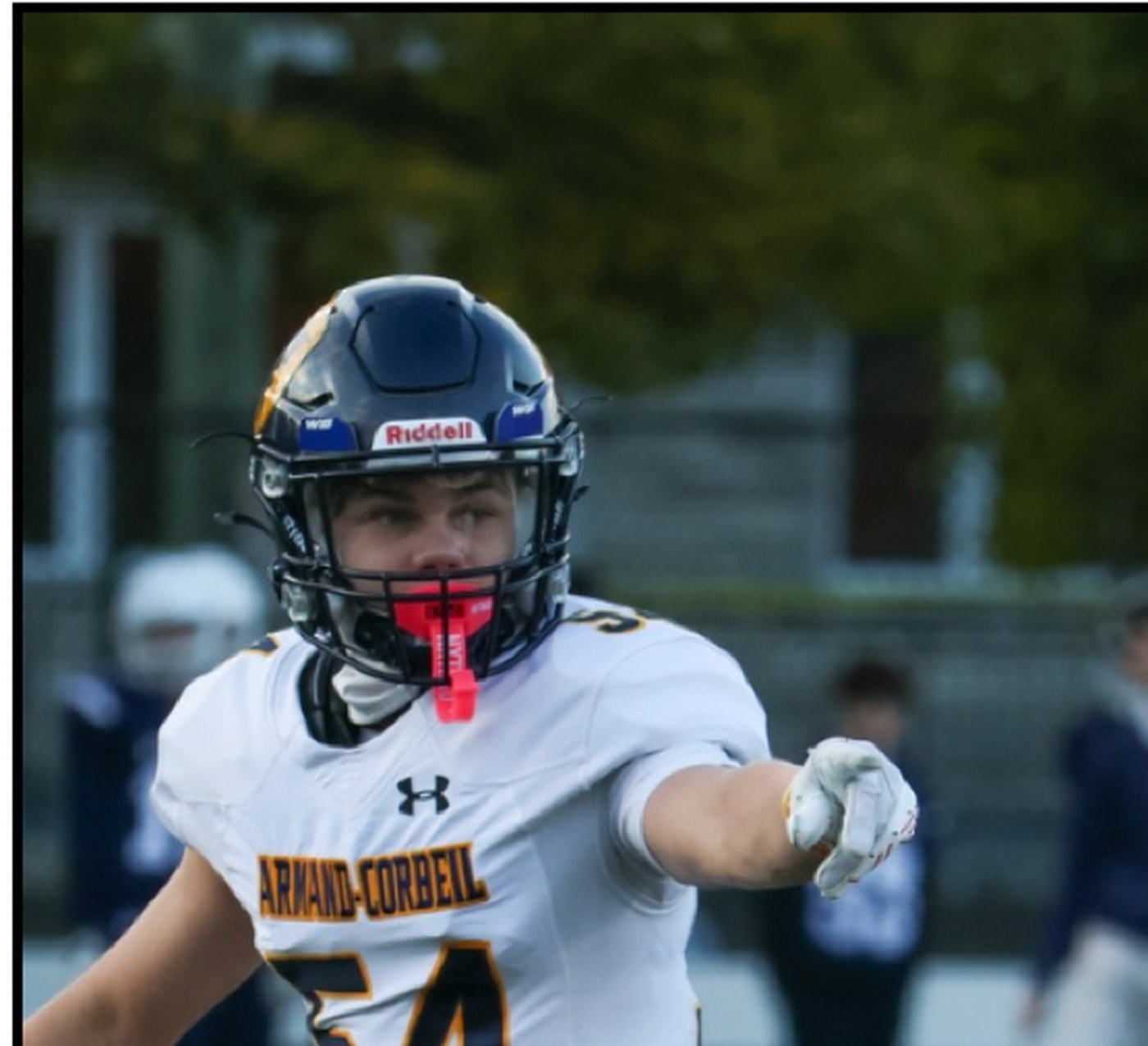 Football player pointing before a play