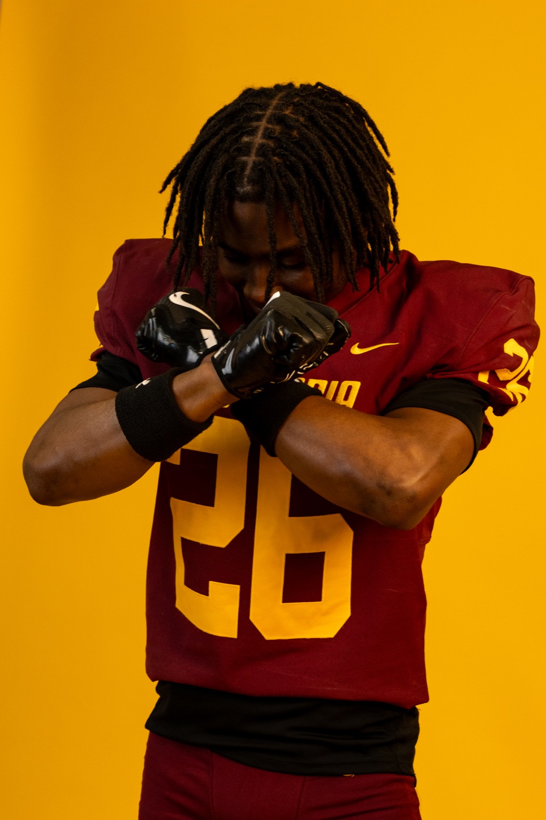 Concordia Stingers football player with flag