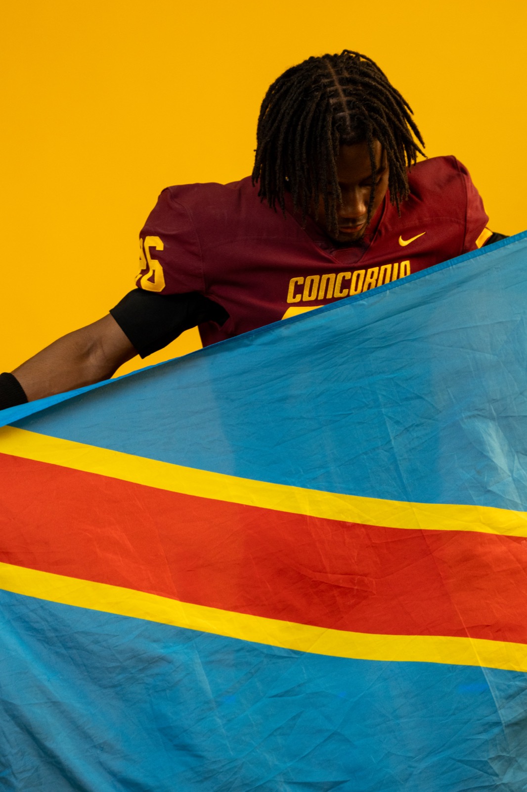 Concordia Stingers player with blue flag
