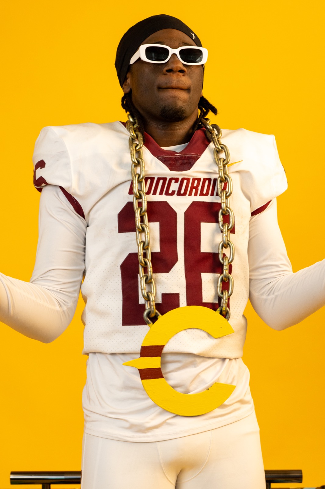 Concordia Stingers player holding chain prop